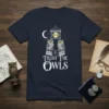 Trust The Owls quote with two owls on books, moon, and clock tower graphic on a navy t-shirt