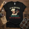Chef holding cupcakes with text "Try My New Recipe They're Called Shut The Fucupcakes" on a black t-shirt