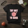 Black t-shirt with white text "TRY NOT TO SUCK" and a red and white target with an arrow, representing the