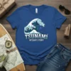 Tsunami Ocean's Fury text with a large blue and white crashing wave graphic on a royal blue t-shirt
