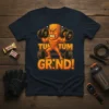 TUM TUM GRIND! text and cartoon bodybuilder lifting weights graphic on a dark t-shirt