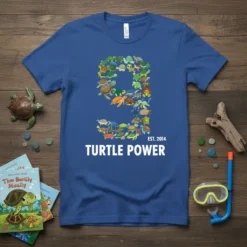 Blue t-shirt with a large number 9 design made of many small turtles, featuring the text "TURTLE POWER EST. 2014"