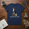Tuxedo cat sitting on books with text "tuxedo cats rule" on navy t-shirt