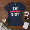 Navy blue t-shirt with white text "TW SİST" and red fist bump graphic, symbolizing twin sisters