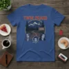Twin Peaks Welcome Sign Women T-Shirt featuring the show's iconic entrance sign and three female characters in a circular graphic