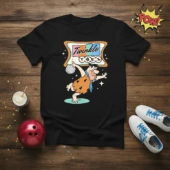 Black t-shirt featuring a cartoon character bowling with "Twinkle Toes" text in a retro banner design