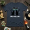 Retro t-shirt design featuring the text "TWO COOL CATS" above two black cats with colorful bow ties and sparkling stars