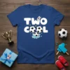 Blue t-shirt with "TWO COOL" text and soccer balls graphic, celebrating a 2nd birthday