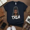 TXLA graphic t-shirt featuring a stylized illustration of a Black woman with intricate braids and the text "TXLA" below her