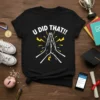 Black t-shirt with white text "U DID THAT!!" and praying hands graphic with yellow lightning bolts