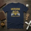 Navy t-shirt with "Ukraine Freedom & Strength" text and golden trident symbol above a castle graphic