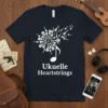 Ukuelle Heartstrings text design with a burst of ukuleles and a musical note, printed on a navy t-shirt