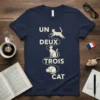 Un Deux Trois Cat T-Shirt with playful French feline counting design in cream text and graphics