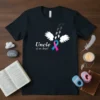 Uncle of an Angel t-shirt design with footprints, white wings, and a pink and blue awareness ribbon