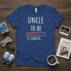Uncle To Be Is Loading text with a progress bar and heart icons on a navy blue t-shirt