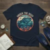 Under The Deep Blue Sea t-shirt design featuring a large fish swimming in a circular ocean scene with coral and