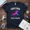 Unicorn Magic Dreams text with a vibrant, gradient unicorn graphic and constellation stars on a navy t-shirt