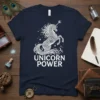 Navy t-shirt with white "UNICORN POWER" text and a detailed white unicorn graphic with stars and crescent moons