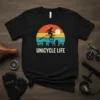 Unicycle Life t-shirt design featuring a silhouette rider on a unicycle against a retro sunset and city skyline