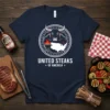 United Steaks of America text with bull and BBQ graphic on a navy t-shirt, featuring a map of the USA