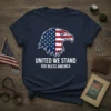 Navy t-shirt with white text "United We Stand God Bless America" and an eagle graphic blending the American flag design
