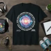 Black t-shirt with circular text "UNITY HAVING FUN PEACE LOVE LVP ELINT PEQAION PLACE HOVIVIY UNIN" surrounding a colorful galaxy