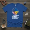 Blue t-shirt with a lion head design split between the American and Ukrainian flags, with text "UNITY STRENGTH SUPPORT" below