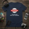 Navy t-shirt with "UNSUBSCRIBE" button graphic and text "Unsubscribed from your opinions"