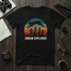 Black cat leaping over a colorful city skyline with "URBAN EXPLORER" text on a t-shirt