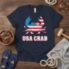 Navy t-shirt with "USA CRAB" text and a crab graphic incorporating the American flag design and sunglasses