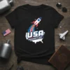 USA FREEDOM FLIGHT t-shirt design with a rocket launching over the USA map, featuring red, white, and blue colors