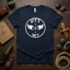 Navy blue t-shirt featuring the UTT N S WT logo with compass and eagle graphics in white