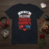 Black t-shirt with "V IS FOR VALENTINE VIDEO GAMES" text, crossed out Valentine, pixelated font, and gaming controllers graphic