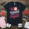 V Valentine very Pregnant text design with a pink pregnant belly graphic, on a navy blue t-shirt