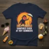 Vampires Suck At Hot Summers t-shirt with a cartoon vampire holding an umbrella in a desert landscape