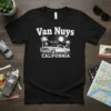 Black t-shirt with "Van Nuys Hollywood California" text, a vintage car, palm trees, and a sun graphic