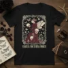 Vanitas Nocturna Morte t-shirt design featuring a gothic fairy holding skulls amidst butterflies and floral elements