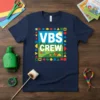 VBS CREW text with camping scene and colorful geometric border on a navy t-shirt