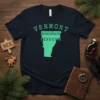 Vermont Northeast Kingdom map design with green outline and text on a navy t-shirt