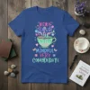 T-shirt with colorful text: Very Demure Cutest Very Mindful Very Considerate, featuring a teacup graphic and playful embellishments
