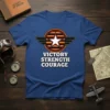 Victory Strength Courage text with wings and star graphic on a blue t-shirt