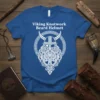 Viking Knotwork Beard Helmet T-Shirt with intricate white Norse design on a blue shirt