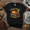 Vintage Fashion Is Straight Fire text with a red classic car on fire graphic on a black t-shirt