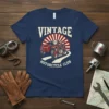 Vintage Motorcycle Club text with a retro motorcycle and sidecar graphic on a navy blue t-shirt