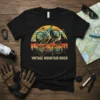 Vintage Mountain Biker T-Shirt with retro bicycles, mountains, and sunset graphic
