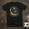 Black t-shirt with a circular design featuring a woman playing soccer, moon, stars, and the text VIRGOOAL