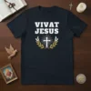 Vivat Jesus Christian T-Shirt featuring bold white text, a glowing cross, and laurel wreath graphic