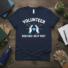 Navy blue t-shirt with white text "VOLUNTEER HOW CAN I HELP YOU?" and graphic of hands holding a heart