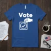 Blue t-shirt with the word "Vote" in large white letters and a graphic of a hand casting a vote in