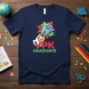 VPK GRADUATE t-shirt with a cartoon rocket ship blasting off, surrounded by graduation caps and books